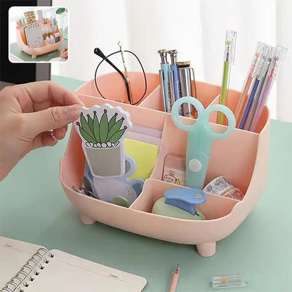 Organisateur de bureau rose à six compartiments pour fournitures diverses.
