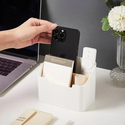 Organiseur de bureau blanc à deux compartiments, main prenant un smartphone 